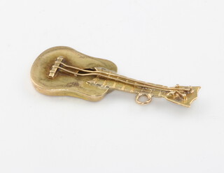 A 9ct yellow gold guitar charm 1.4 grams 