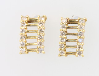 A pair of 9ct yellow gold diamond earrings, 1.8 grams