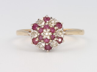 A 9ct yellow gold ruby and diamond cluster ring, 2 grams, size P