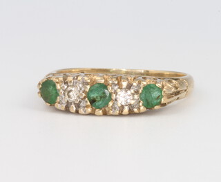 A 9ct yellow gold emerald and diamond ring, 2.8 grams, size K 1/2