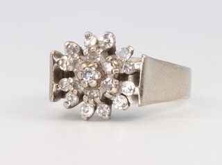 An 18ct white gold diamond cluster ring, 6.1 grams, size J 