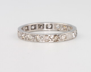 A platinum and diamond eternity ring, 1.7 grams, size K 1/2