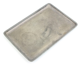 A rectangular silver dressing table tray with engine turned decoration Birmingham 1923, 346 grams 