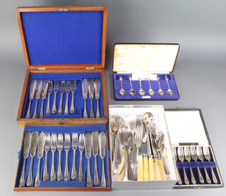 A mahogany canteen containing a set of plated fish eaters for 12 and minor plated cutlery 