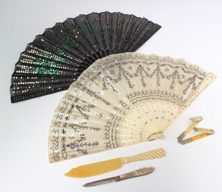 An Edwardian silver and mother of pearl fruit knife, a folding ruler and paper knife together with 2 fans