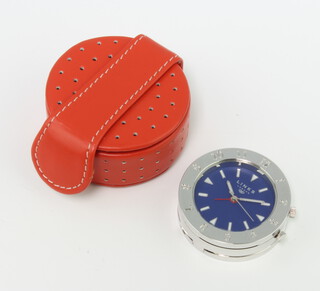 A silver plated Links bedroom timepiece contained in a leather pouch 