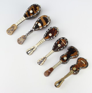 A collection of mother of pearl and bone miniature musical instruments - 2 guitars and 4 mandolins