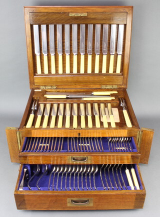An oak canteen of cutlery for 12 by Thomas Turner and Co 