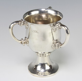 An Edwardian style silver 3 handled loving cup with baluster bowl and waisted stem, 318 grams, 13cm, hallmarks rubbed