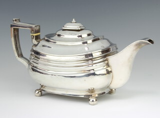 A George III silver oblong teapot raised on ball feet, Edinburgh 1796, gross weight 756 grams  