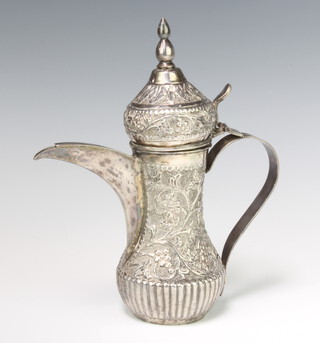 A Persian repousse silver baluster coffee pot decorated with formal scrolling flowers, 486 grams, 23.5cm 