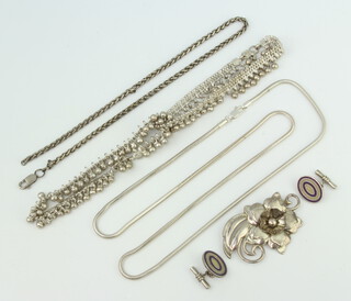 A repousse silver brooch and minor silver jewellery, 146 grams