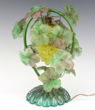 A 1930's Murano green glass table lamp in the form of a bunch of grapes with vinery decoration, raised on a green and gold glass spreading base 37cm h x 18cm diam. 
