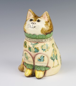 A Rye Pottery Joan and David De Bethel cat dated 1989 with glass eyes and decoupage decoration, the collar inscribed The only way to have a friend is to be one 19cm 