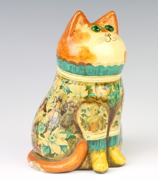 A Rye Pottery cat by Joan and David De Bethel with glass eyes and decoupage decoration, in commemorative of the Queen's Silver Jubilee, 21cm  