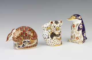 A Royal Crown Derby Imari pattern paperweight of a Koala and baby gold stopper 10cm, a ditto duck billed platypus 11cm (no stopper, second) and an armadillo silver stopper 9cm 