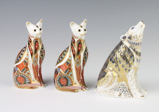 A Royal Crown Derby Imari pattern paperweight of a wolf with gold stopper 14cm, two ditto cats silver stoppers 14cm 