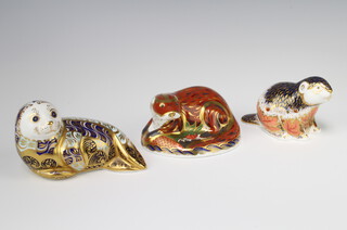 A Royal Crown Derby Imari pattern paperweight of a riverbank beaver no.3688/5000, gold stopper 8cm, ditto otter 7cm gold stopper and a harbour seal no.3090/4500 silver stopper 8cm   