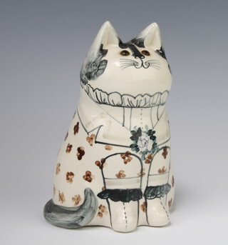 A Rye Pottery David De Bethel cat with glass eyes, dated 1986, decorated a floral frock coat 17cm 