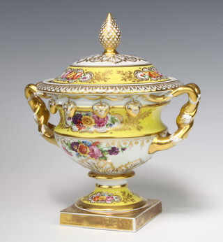 A Portuguese Vista Alegre porcelain 2 handled urn and cover decorated with spring flowers with pineapple finial raised on square base 24cm 