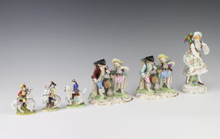 A pair of modern Dresden figure groups of grape gatherers raised on rococo bases 13cm, a German figure of a flower seller 18cm and 3 German figures of soldiers on horseback 7cm 