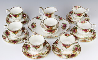 A Royal Albert Old Country Roses part tea set comprising 7 tea cups, 6 saucers, sugar bowl, milk jug, 6 small plates, sandwich plate
