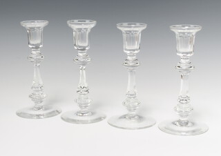 Four Waterford Crystal candlesticks with waisted stems, 20cm 