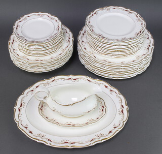 A 41 piece Royal Doulton Strasbourg patterned dinner service comprising 9 dinner plates, 8 soup bowls, oval meat plate, 12 side plates, sauce boat and stand, 11 tea plates
