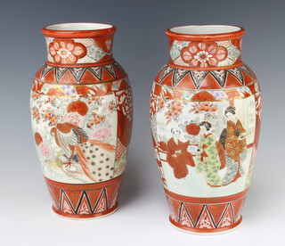 A pair of early 20th Century Kutani baluster vases decorated with panels of figures 31cm 