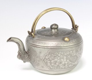 An early 20th century Chinese pewter tea pot with floral decoration