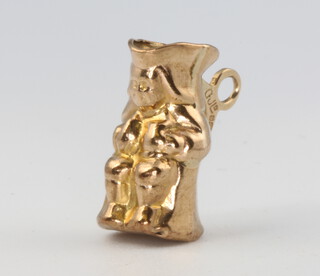 A 9ct yellow gold Toby jug charm, 1.5 grams 