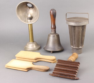 A 19th Century waisted metal ice cream/jelly mould 21cm x 13cm, a reading light with deflector 30cm x 11cm, a hand bell with turned wooden handle, 2 pairs of butter pats and an iron and wooden carding brush 