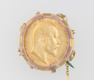 A sovereign brooch 1910, contained in a 9ct yellow gold 2 gram mount 
