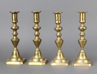 Two pairs of 19th Century brass candlesticks with knopped stems and ejectors 23cm 