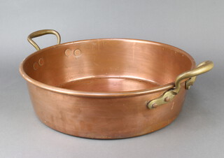 A circular copper preserving pan with brass twin handles 12cm x 43cm 