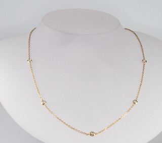 A 14ct yellow gold diamond set necklace, the diamonds approx. 0.25ct