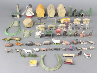 A collection of Britains lead farmyard animal figures, haystacks, windmill etc