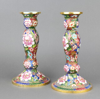 A pair of champleve enamelled club shaped candlesticks with floral decoration 23cm 