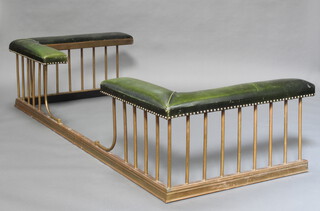 A brass club fender upholstered in green leather, 47cm h x 212cm w x 93cm d 