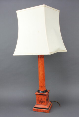 A red lacquered table lamp in the form of a column raised on a square base 54cm x 15cm 