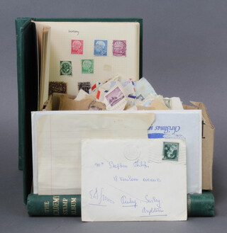 Two green Academy albums of Commonwealth and world stamps including Jamaica, Ceylon, Canada, France, Spain, Japan, Portugal, India together with a shallow box of loose stamps 
