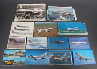 A quantity of various black and white and coloured postcards and photographs of 1950/60's commercial airlines 
