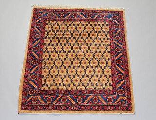 A brown and red ground Persian rug with geometric designs to the centre 155cm x 129cm 