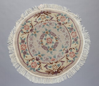 A white and floral patterned circular Chinese rug 98cm diam. 