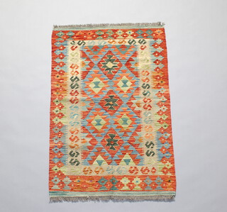 An orange and green ground Chobi Kilim rug 121cm x 76cm 