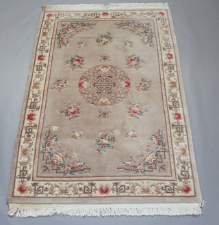 A mushroom ground and floral patterned Chinese carpet 282cm x 184cm  