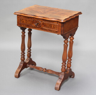 A Victorian quarter veneered walnut work table of serpentine outline, fitted a drawer, raised on 4 turned supports with H framed stretcher 66cm h x 53cm w x 37cm d 