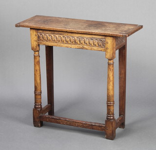 A late 19th century rectangular carved oak side table formed of old timber, raised on turned and block supports 71cm h x 78cm w x 27cm d 
