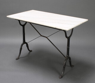 A rectangular Victorian style iron trestle table with white veined marble top 70cm h x 99cm w x 60cm d