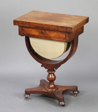 A William IV mahogany games/work table with flip over swivel top, fitted 1 drawer above U shaped basket, raised on a U shaped support with turned column, triform base and bun feet 72cm h x 52cm w x 37cm d